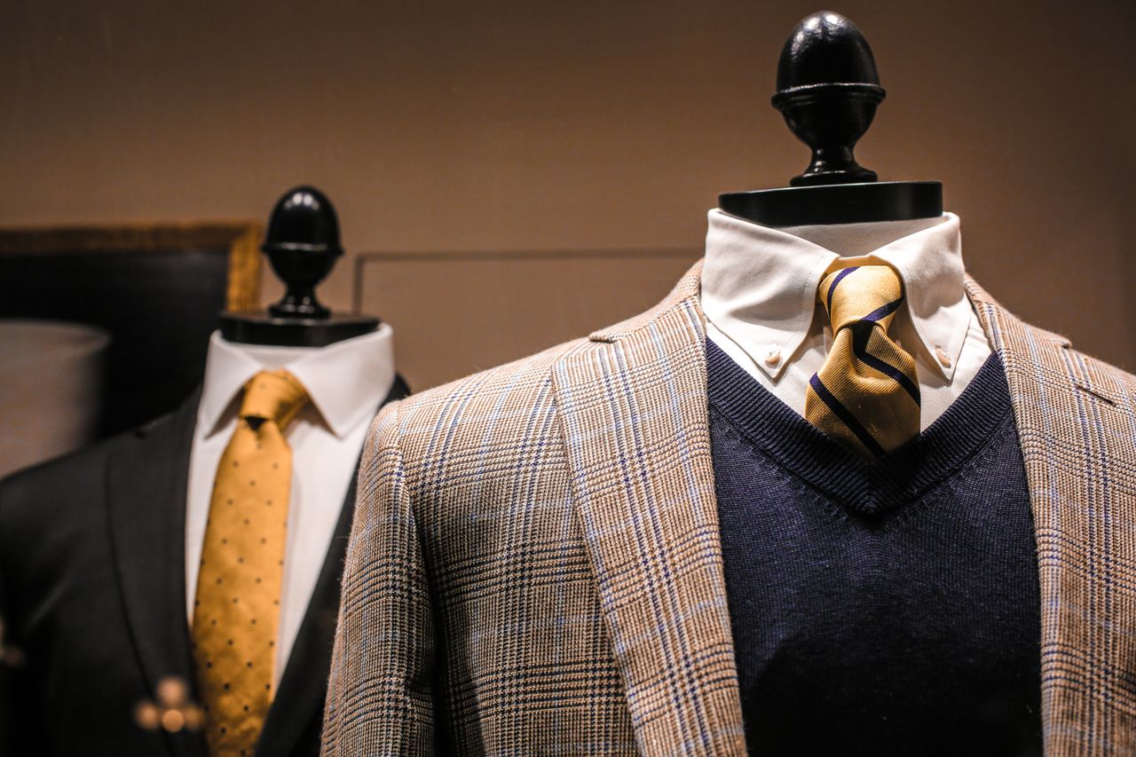 Mastering the First Impression: Your intriguing post title goes here Dandy fancy jackets with shiny ties on dummies in showroom of contemporary male shop